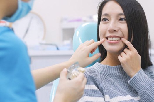 Patient in South End talking to dentist in chair