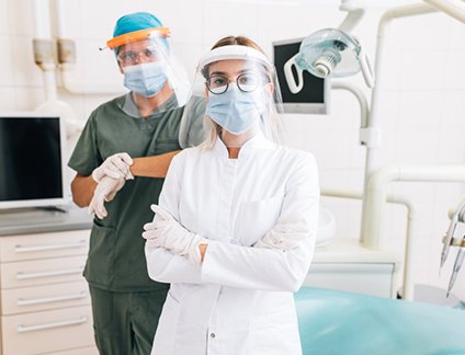 Two dentists ready to treat their patients