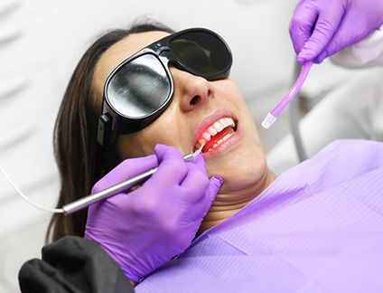 Dental patient having their gums treated with a soft tissue laser