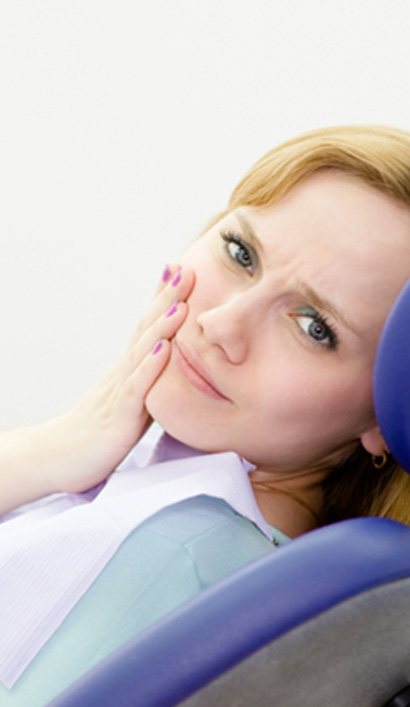 Female dental patient with pain in jaw