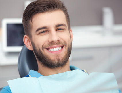 Close-up of male dental patient smiling
