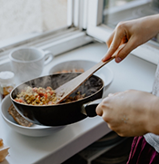 Person cooking stir fry